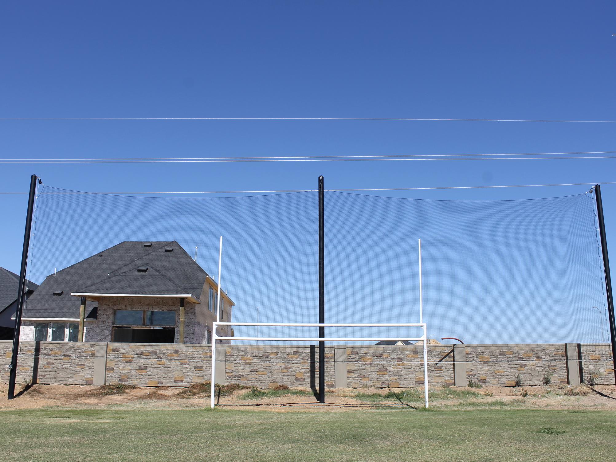 netting behind combined soccer goalpost 